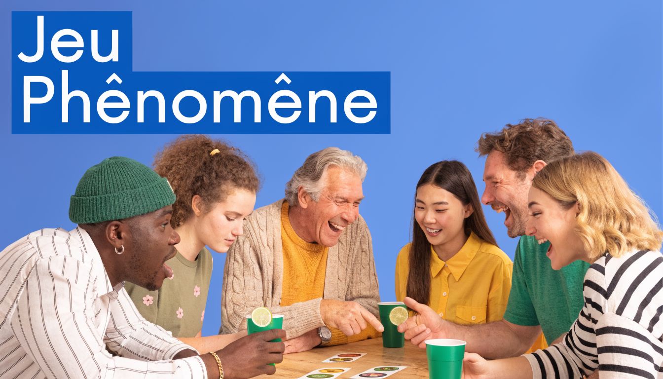 Un groupe diversifié de personnes s'amuse en jouant à un jeu de cartes coloré autour d'une table.